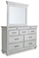 Kanwyn Queen Panel Bed with Mirrored Dresser